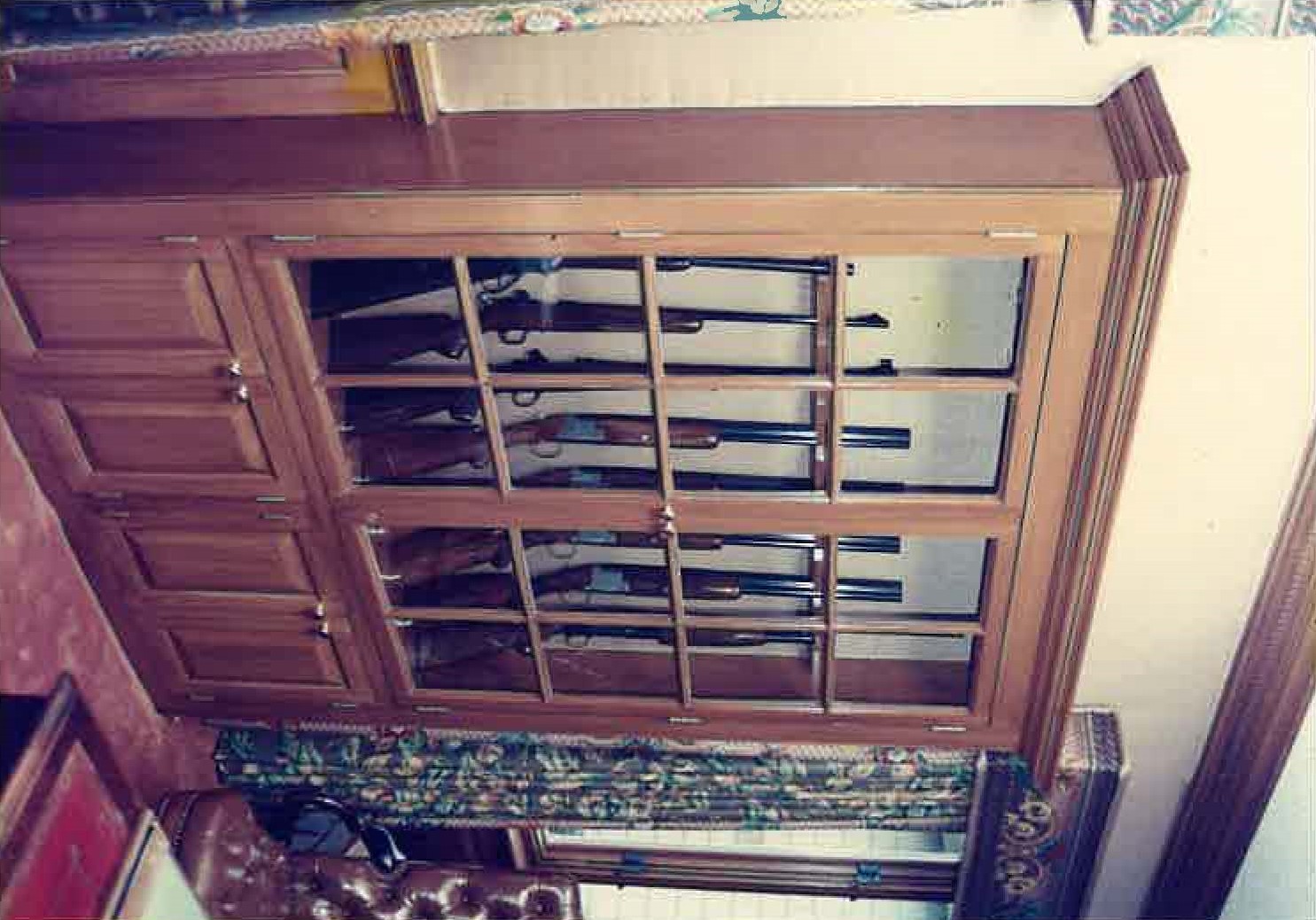 Large glazed display cabinet, natural wood, installed in room