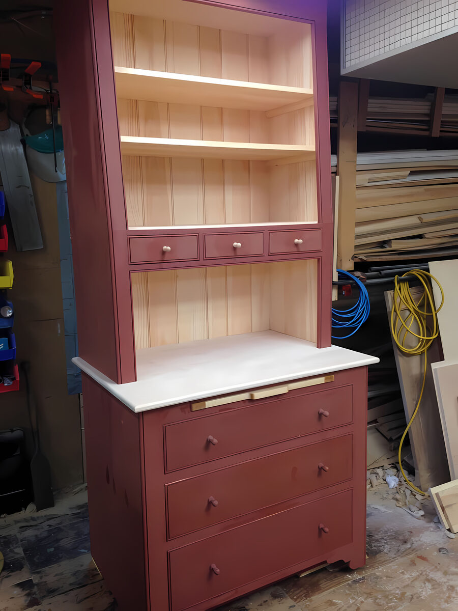 Hand-built red painted hutch with beadboard back and open upper shelving