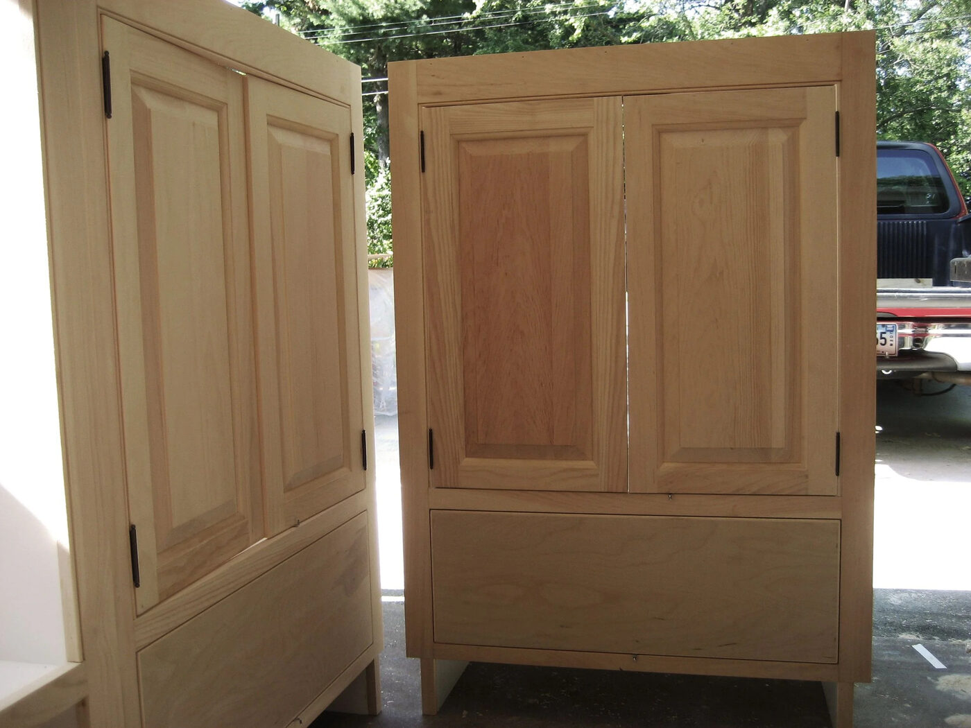 Long wall run of lower cupboard units in sage green, installed