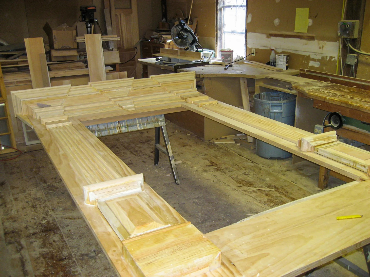 Wide archtop frame assembly laid flat on shop floor