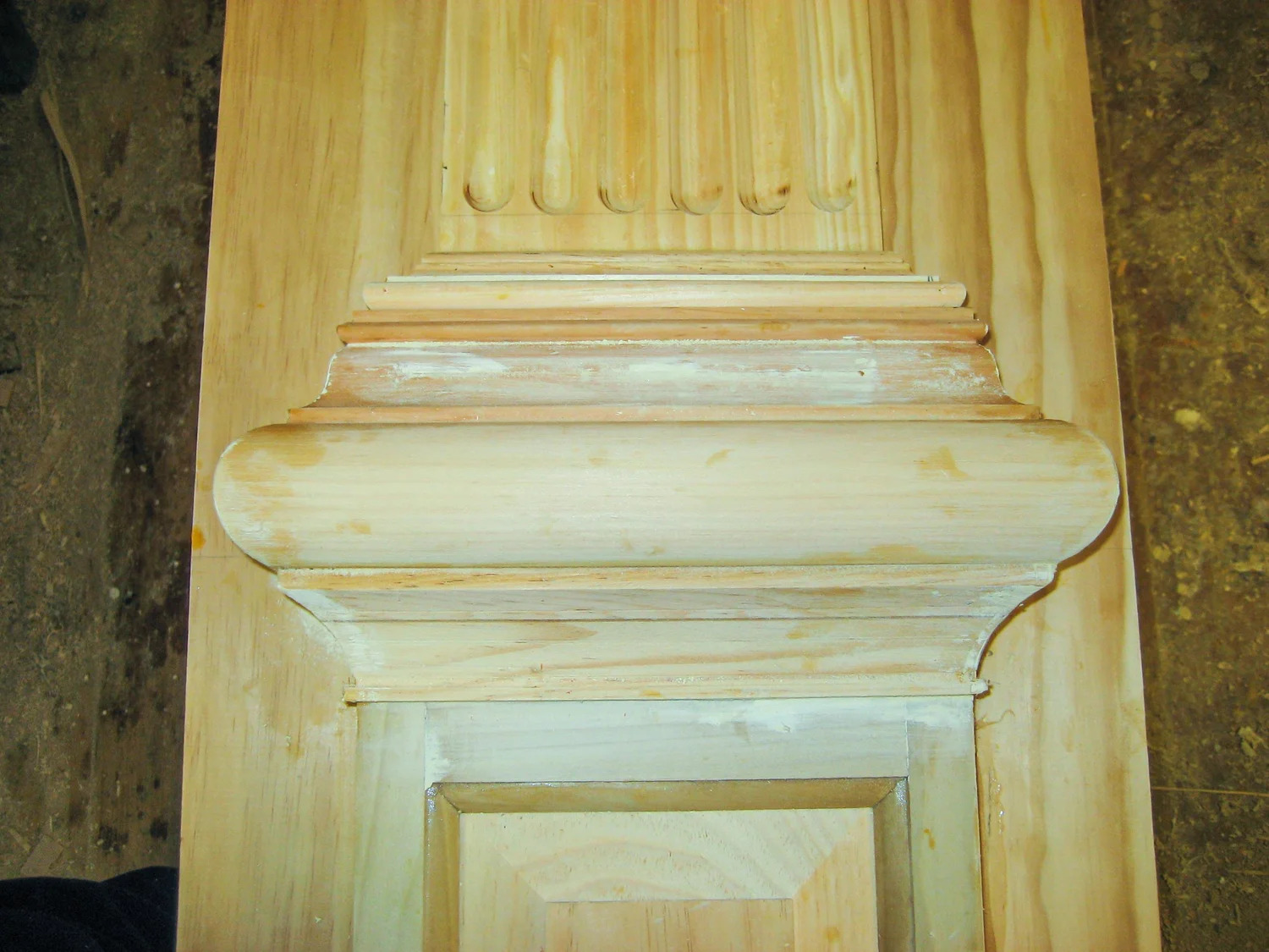 Arch soffit close-up showing painted finish and moulding profile