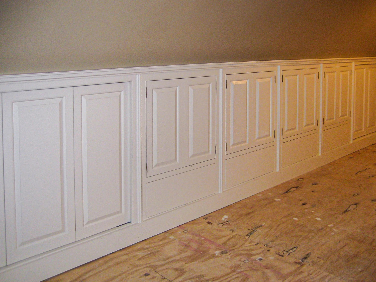 White painted knee-wall panel run installed, wide view from left