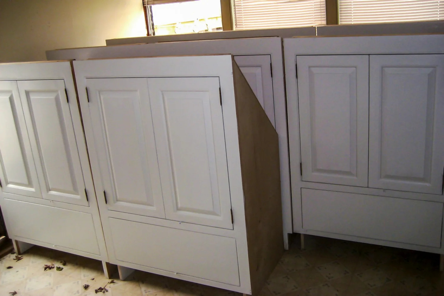 White knee-wall panel run, full room width view, wood floor