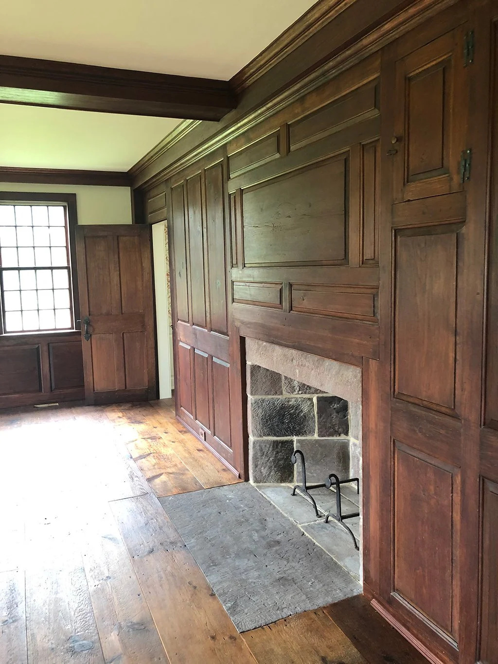 Natural pine panel cladding in attic or upper room, raw wood