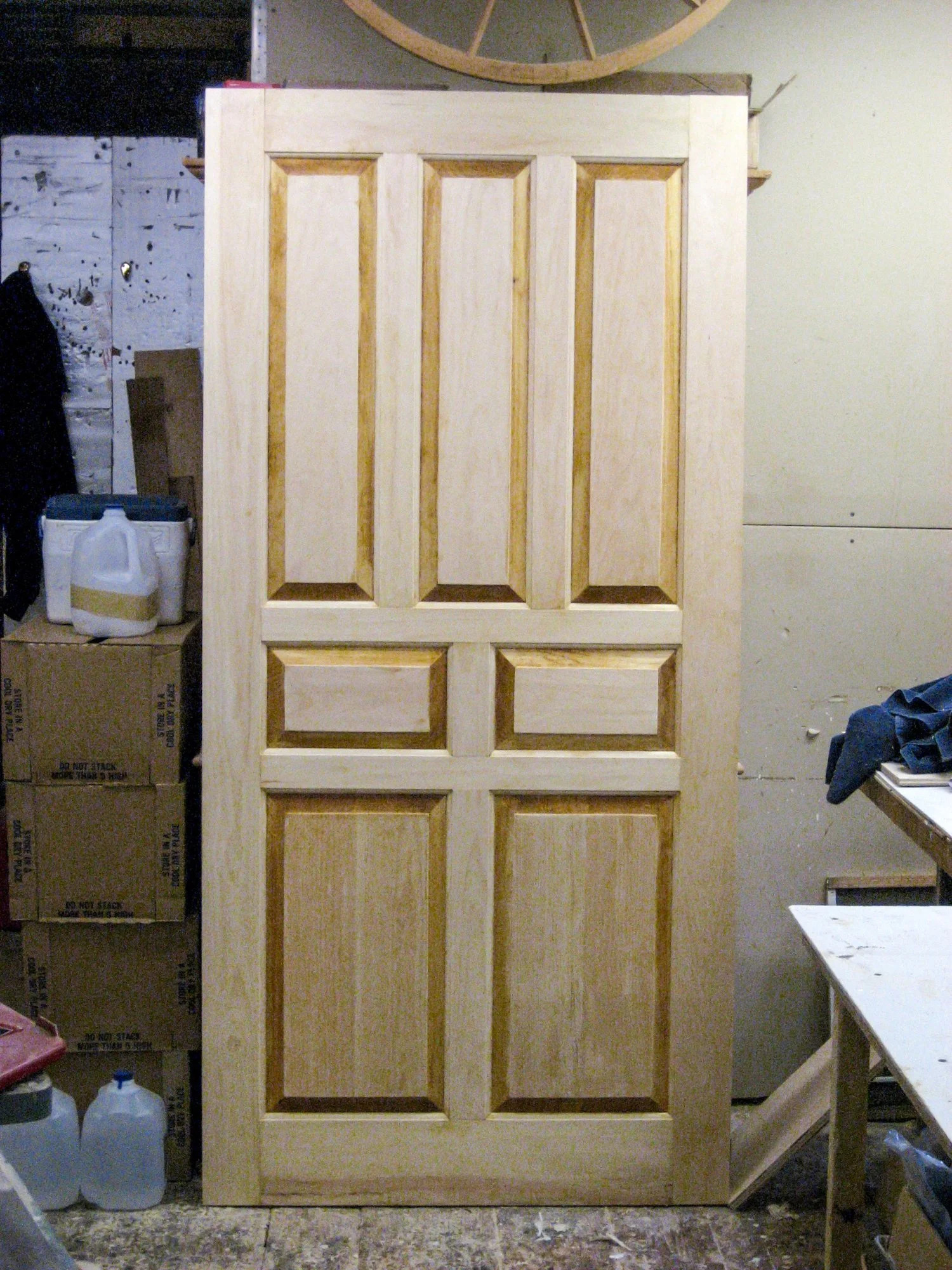 Raised panel door with bolection moulding, natural pine, shop view
