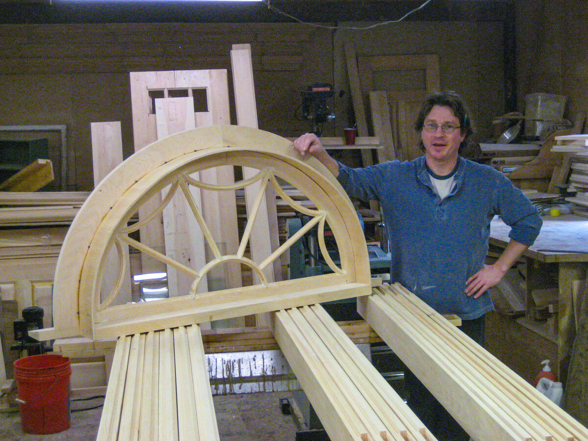 Michael Britten working on custom millwork in his Connecticut woodworking shop