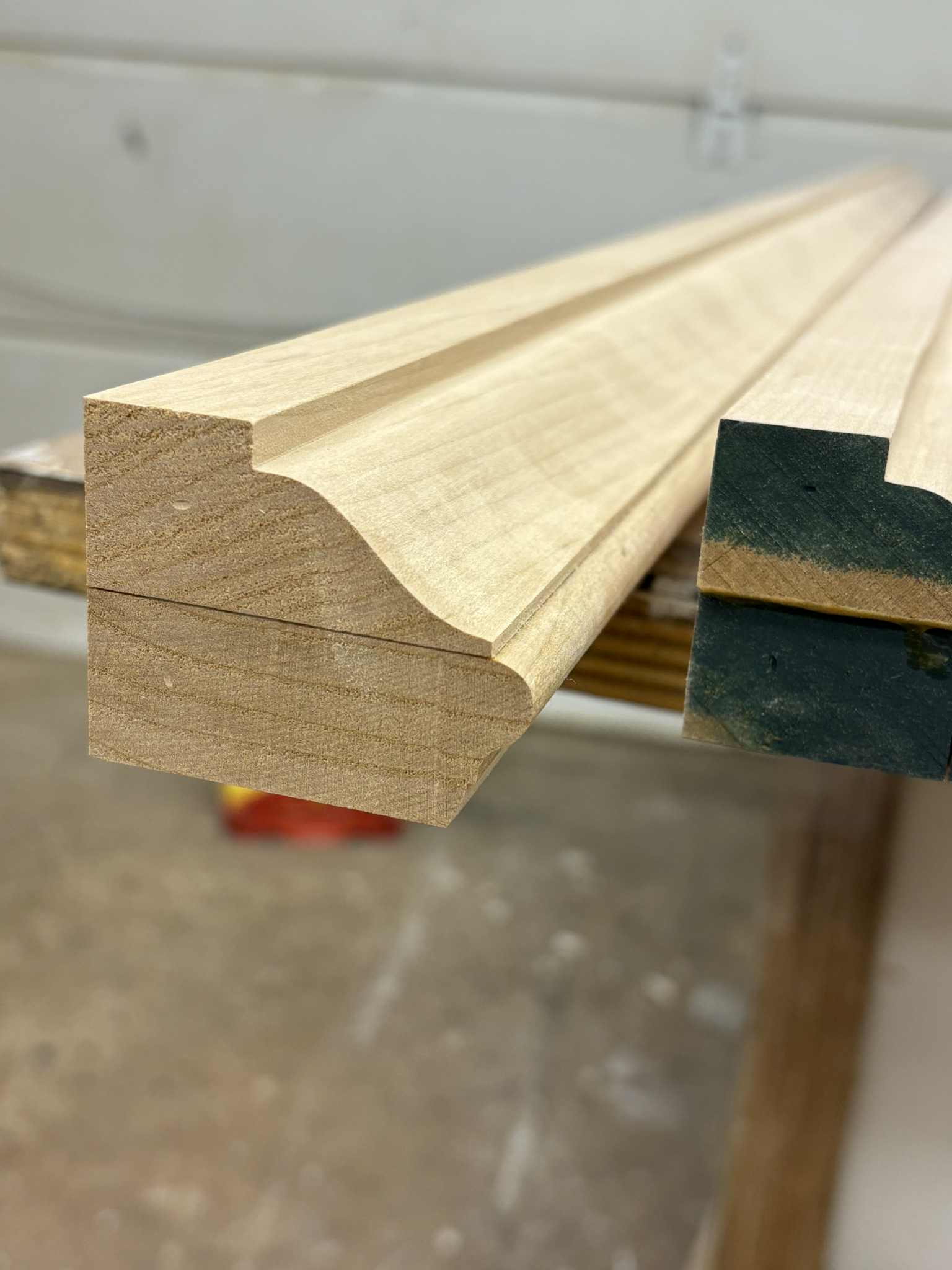 Stair nosing moulding profile, angled close-up, raw pine