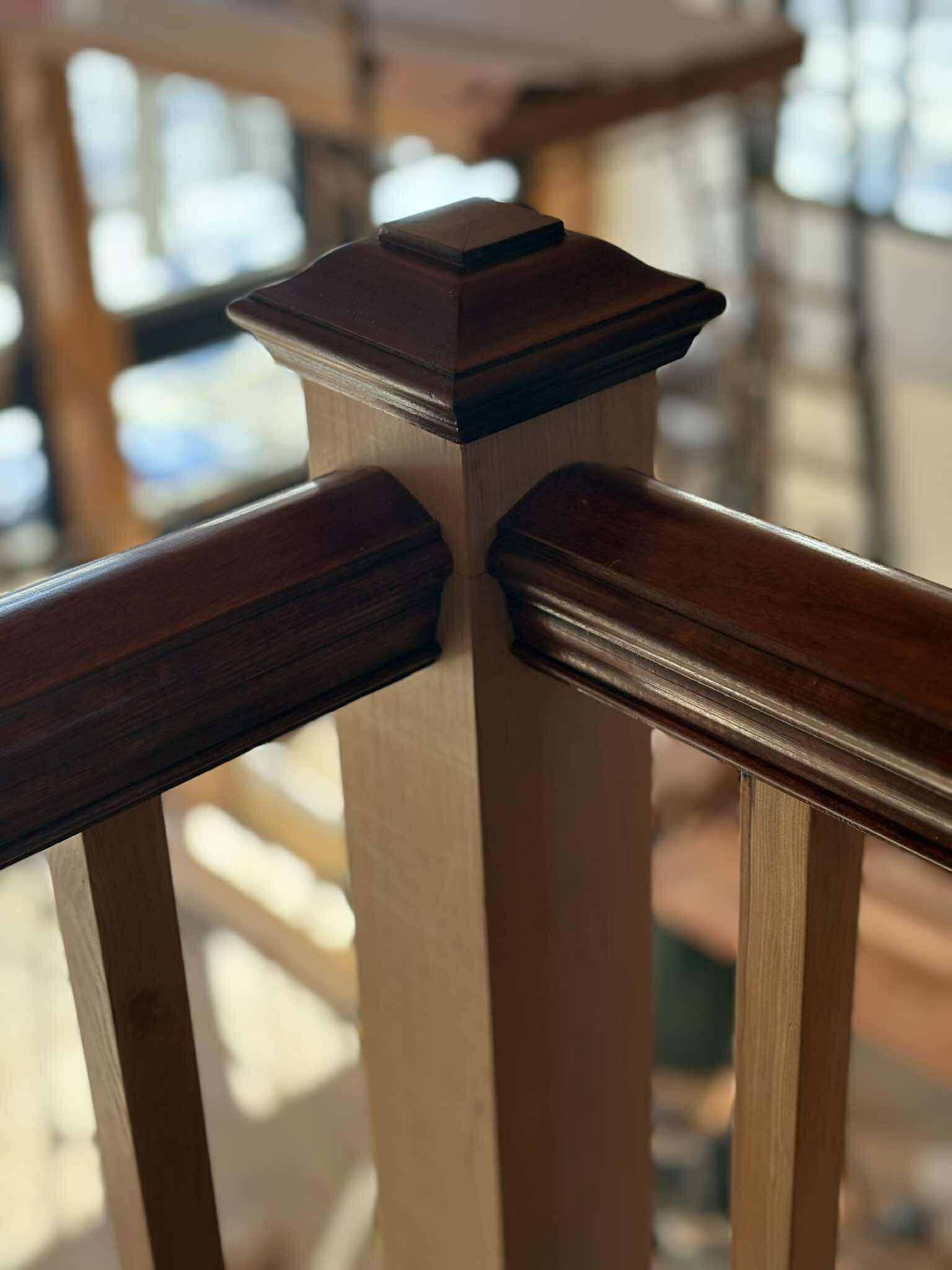 Square newel post cap moulding detail, close-up